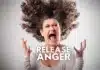 A woman fiercely expressing her emotions with her hair wildly flying around, captioned "healthy way to release anger.