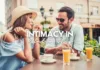 A couple in a relationship enjoying a cozy conversation over drinks at an outdoor cafe, savoring moments of connection as they cherish one of the most important things in their bond.