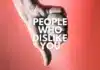 A hand giving a thumbs down gesture against a pink background with the text "How To Deal With People Who Dislike You" overlaying it, symbolizing disapproval or negative feelings.