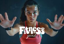 A woman in athletic attire, with her hair pulled back, extends her arms forward as if pushing or reaching towards the camera. She has a focused expression. The text "Fitness Goal" is prominently displayed in stylized white font across the center of the image, embodying Motivational-Affirmations.