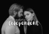 A black and white photo of two people, a man and a woman, standing closely together against a black background. The man, with a beard, is facing the woman, who is looking directly at the camera. The text "Codependent Relationship" is written across the image.