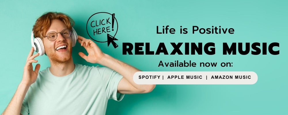 A smiling person wearing glasses and headphones is touching their headphones while standing against a teal background. Text beside them reads "Life is Positive RELAXING MUSIC. Experience the love! Available now on: Spotify, Apple Music, Amazon Music," with a "CLICK HERE!" button above.