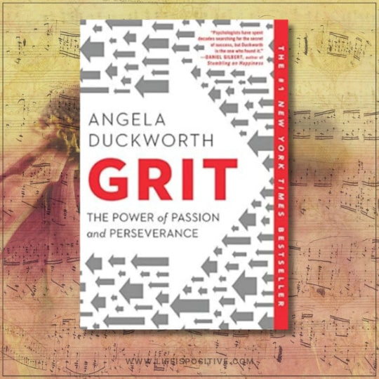 Cover of the book "Grit: The Power of Passion and Perseverance" by Angela Duckworth. The design features a white background with gray arrows pointing in various directions and bold red text for the title. A faint backdrop of musical notes is visible, enhancing the dynamic feel of grit-by-angela-duckworth.